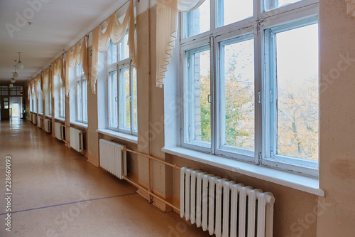 school, education and learning concept - empty school corridor