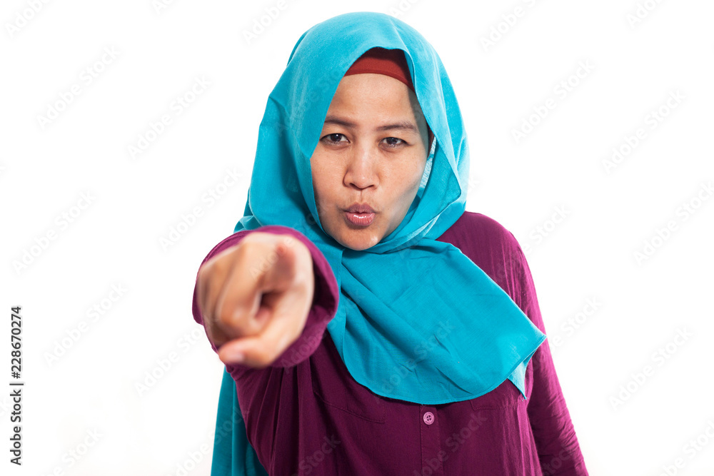 Muslim Woman Showing Smiling and Pointing Forward Muslim Woman Showing Smiling and Pointing Forward