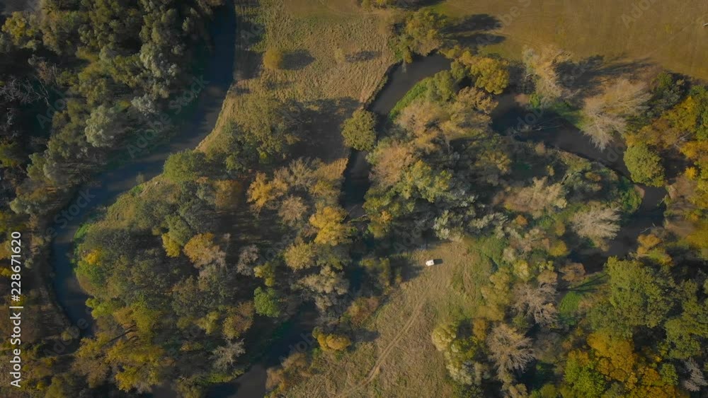 aerial view of a rural landscape with some trees and the meandering river aerial view of a rural landscape with some trees and the meandering river