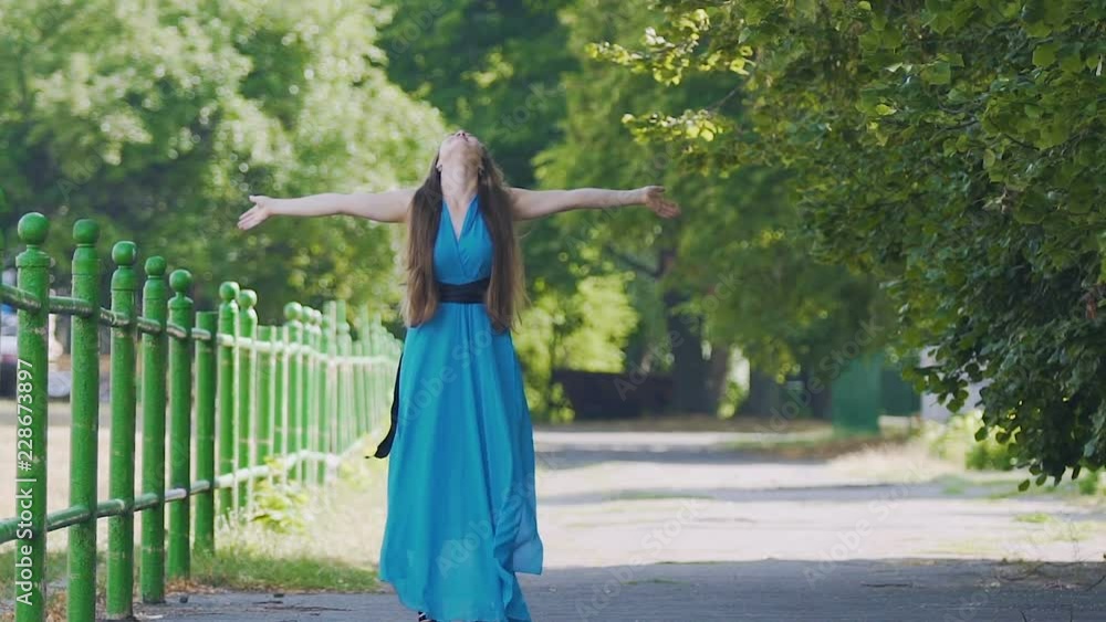 Woman feeling joy of life and happiness, smiles and enjoys existence outdoors Woman feeling joy of life and happiness, smiles and enjoys existence outdoors