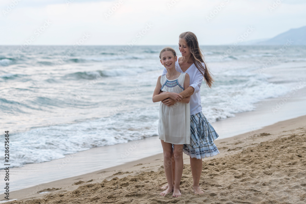 mother and daughter on the beach