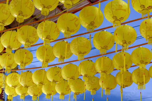 Yellow Chinese lantern in Vegetarian Festival with blue sky photo