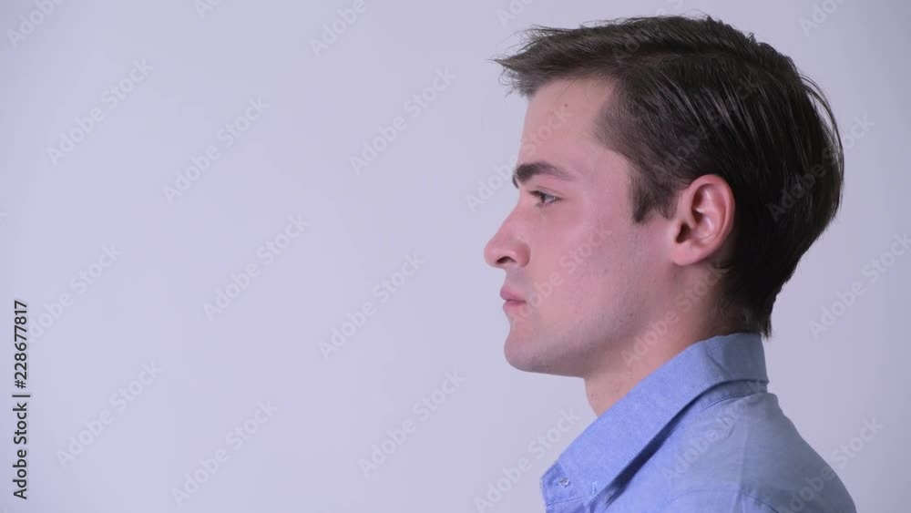 Profile view of young handsome businessman Profile view of young handsome businessman