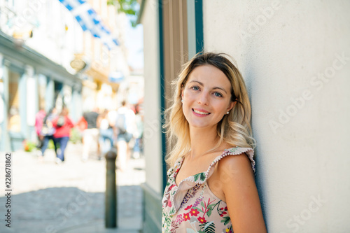 Fashion woman portrait of young pretty trendy girl posing on the quebec city street