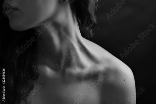 Girl's neck wtih dramatic light.