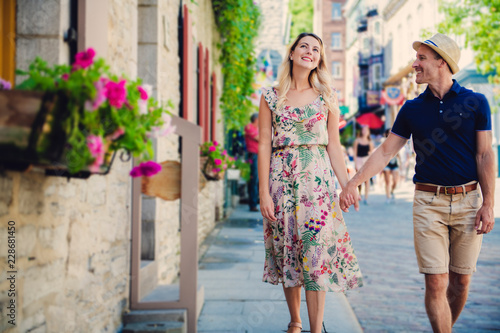 Outdoor lifestyle portrait of young couple in love in old town © Louis-Photo