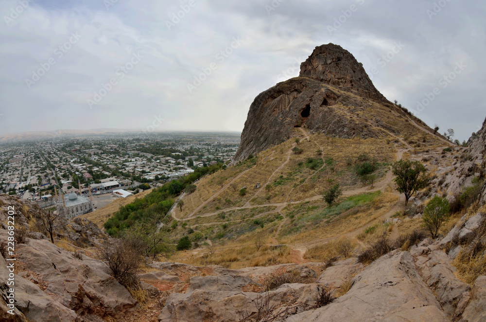 Sacred muslim mountain Suleiman-Too in Osh,Kirgyzstan,Fergana valley. Its five peaks and slopes contain numerous ancient places of worship and caves with petroglyphs