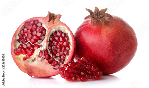 Big red pomegranate fruit and half pomegranate on white isolated background