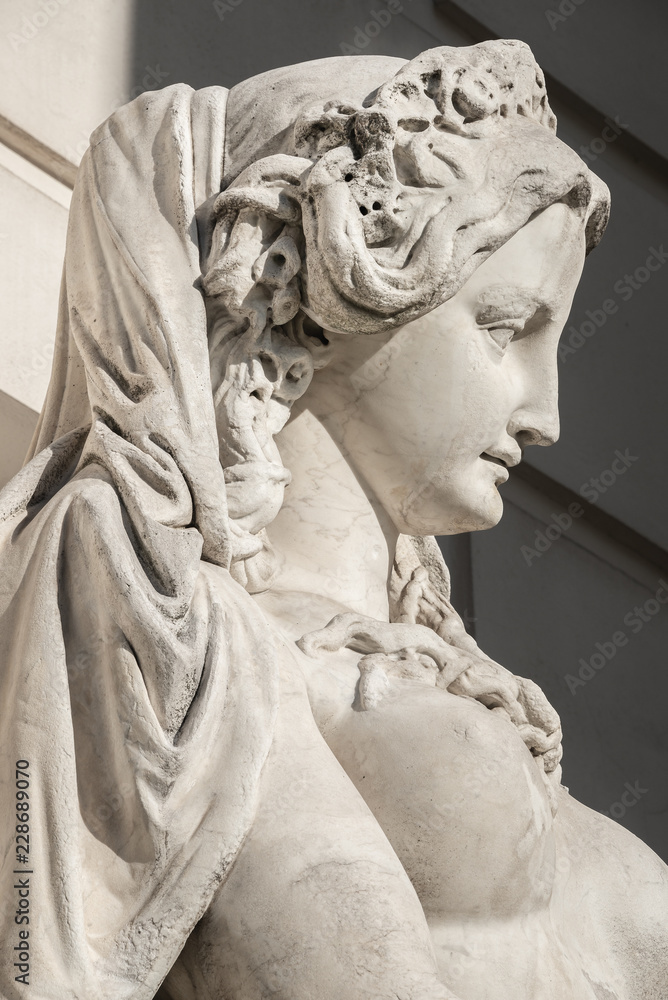 Sensual neoclassic woman marble statue in Burggarten park in Vienna, Austria, details, closeup