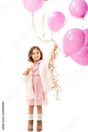 stylish happy child with pink air balloons and ice cream isolated on white