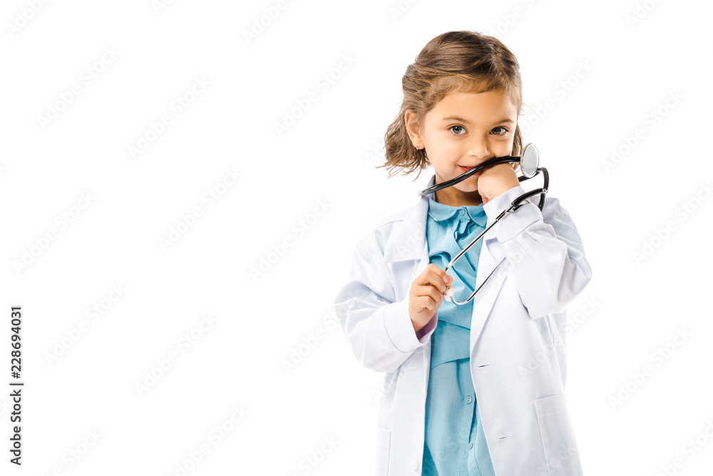 kid dressed in doctors white coat with stethoscope isolated on white