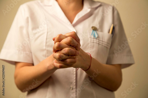 nurse with hand asking please