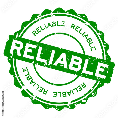Grunge green reliable round rubber seal stamp on white background