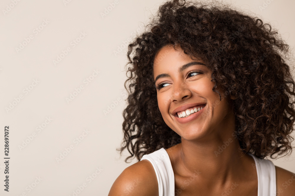 Beauty portrait of black woman on light background Beauty portrait of black woman on light background