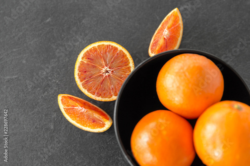 food  fruits and healthy eating concept - close up of fresh juicy blood oranges