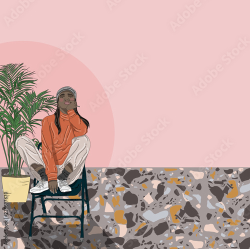 Portrait of young woman sitting on chair