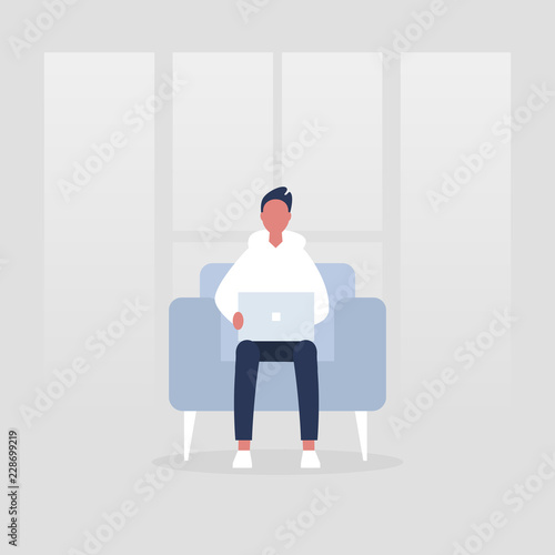 Young manager sitting in a chair with the laptop