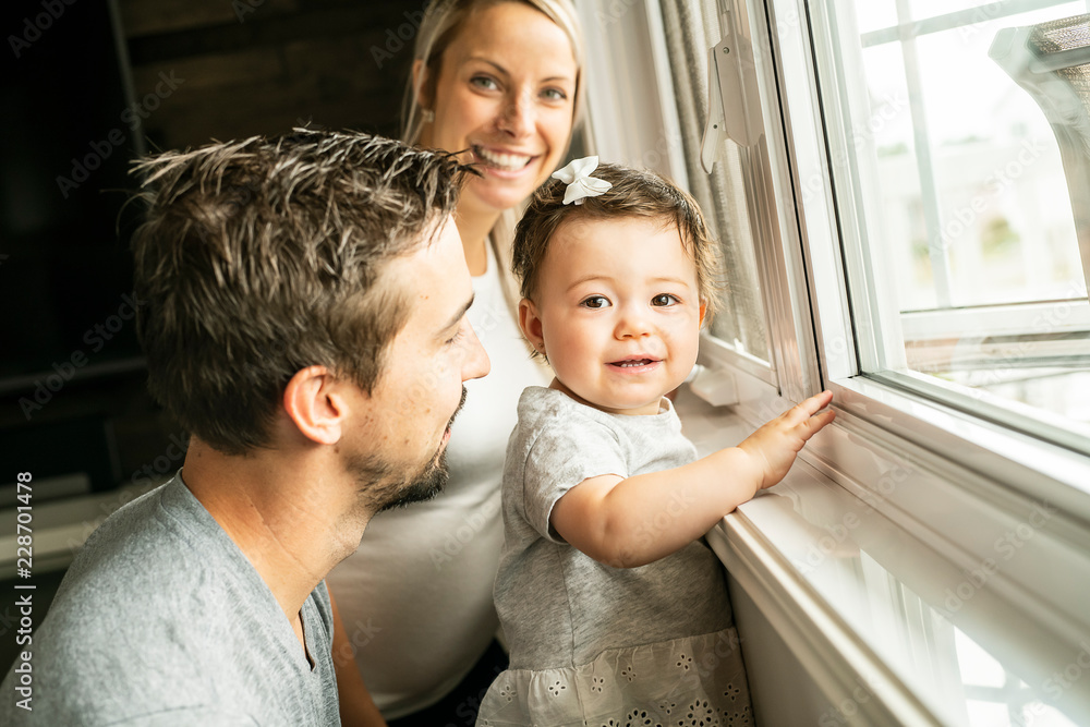 Obraz premium Family sit near window on the livingroom