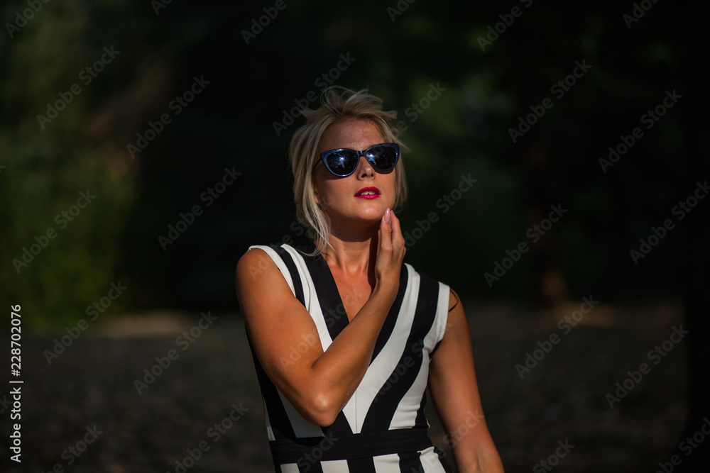 beautiful blonde woman in the autumn forest at sunset beautiful blonde woman in the autumn forest at sunset
