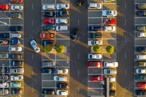 Canvastavla Top down view from drone on mall parking with many cars.