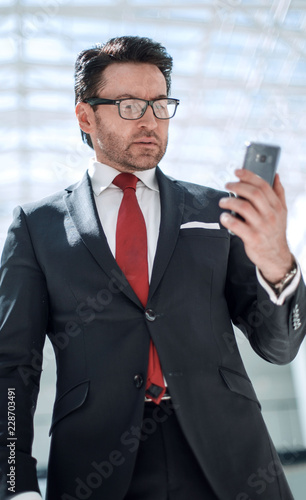 businessman reading text message on smartphone