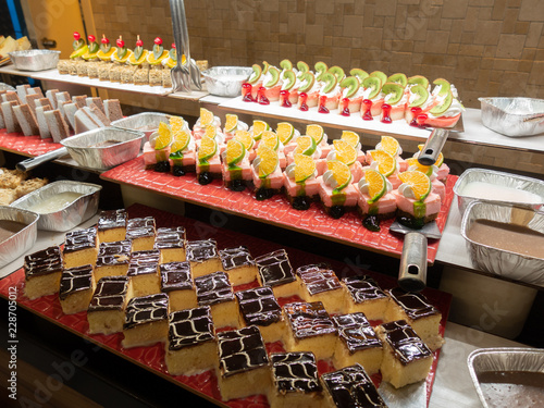Pastries, pastries on the table in the restaurant. Hotel interior, buffet table, dessert, all inclusive. 
