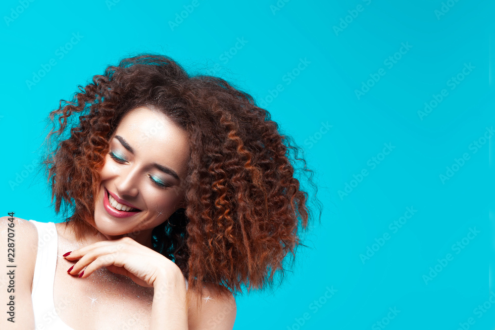 Beautiful smiling young woman on blue background Beautiful smiling young woman on blue background