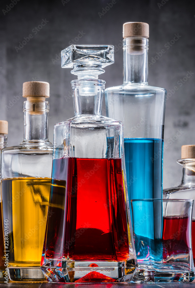 Carafe and bottles of assorted alcoholic beverages. Carafe and bottles of assorted alcoholic beverages.