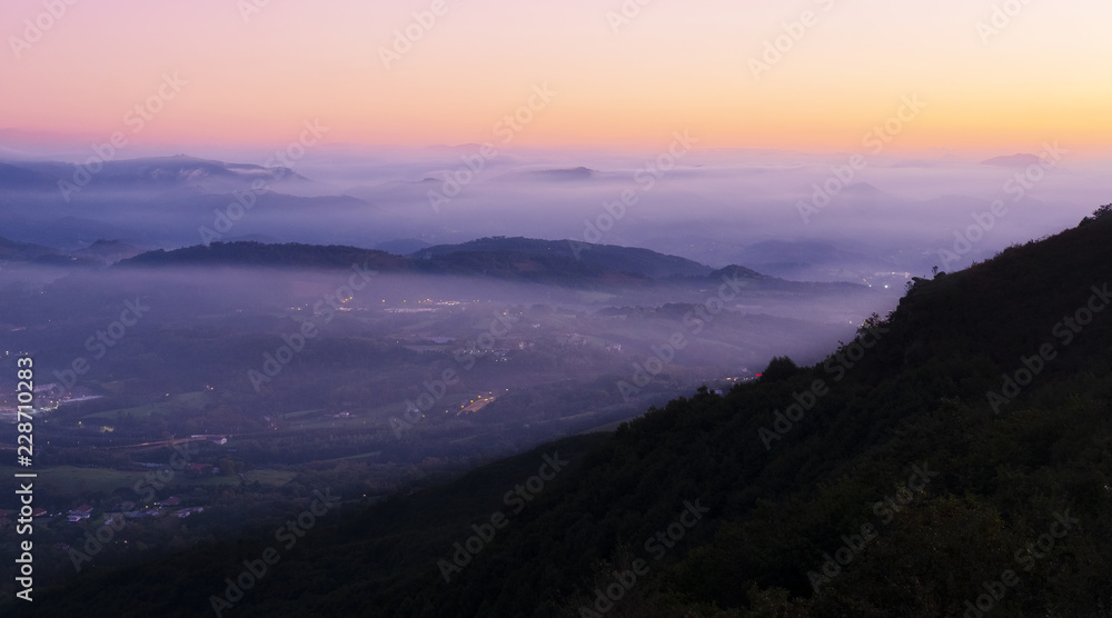 Lights and fog in Gipuzkoa from Mount Jaizkibel at night
