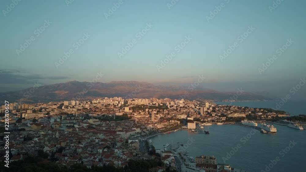 Drone shot of crowded cityscape, mountains in background, Split, Croatia Drone shot of crowded cityscape, mountains in background, Split, Croatia