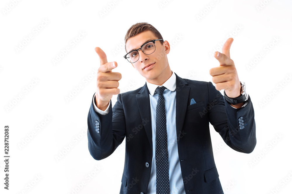 Successful businessman in glasses, smiling cheerfully, pointing fingers at the camera, trying to get your attention, motivating you, on a white background Successful businessman in glasses, smiling cheerfully, pointing fingers at the camera, trying to get your attention, motivating you, on a white background