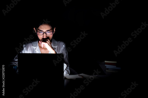 Woman working late at her home office.
