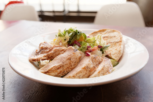 Grilled chicken breast and Greek pita