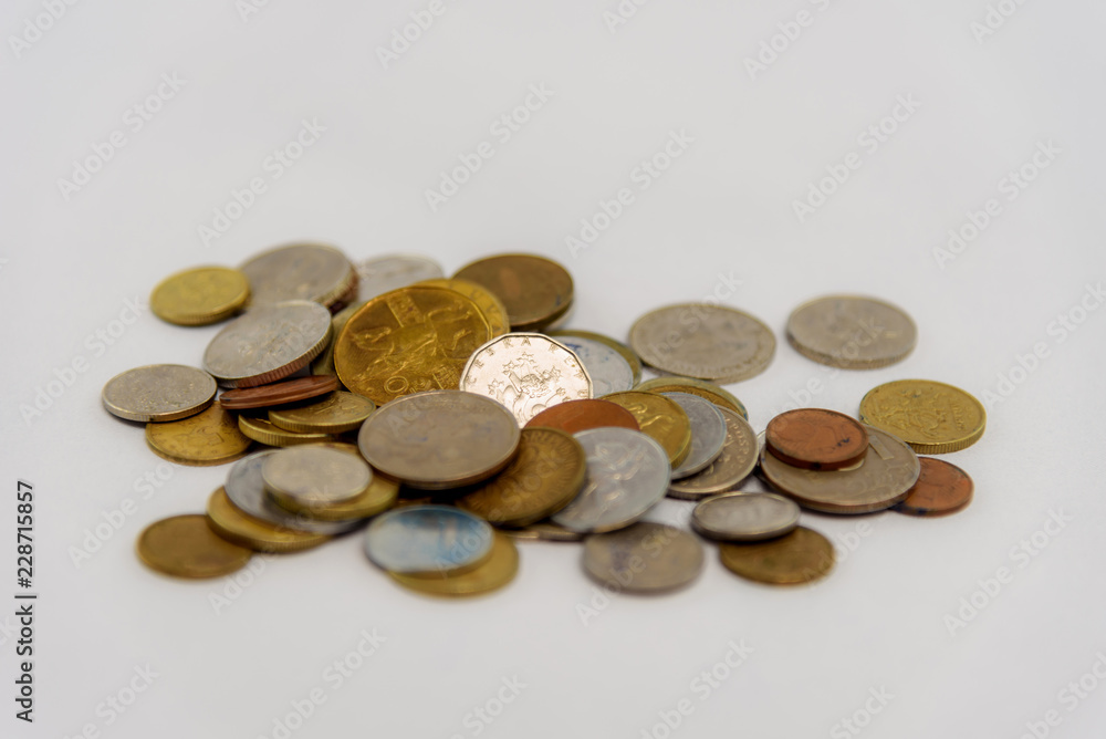 Studio photo of scattered cash coins on white background. Studio photo of scattered cash coins on white background.