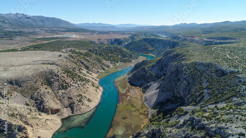 Zrmanja River in northern Dalmatia, Croatia is famous for its crystal clear waters and countless waterfalls surrounded by a deep canyon. This was a site of winnetou filming.