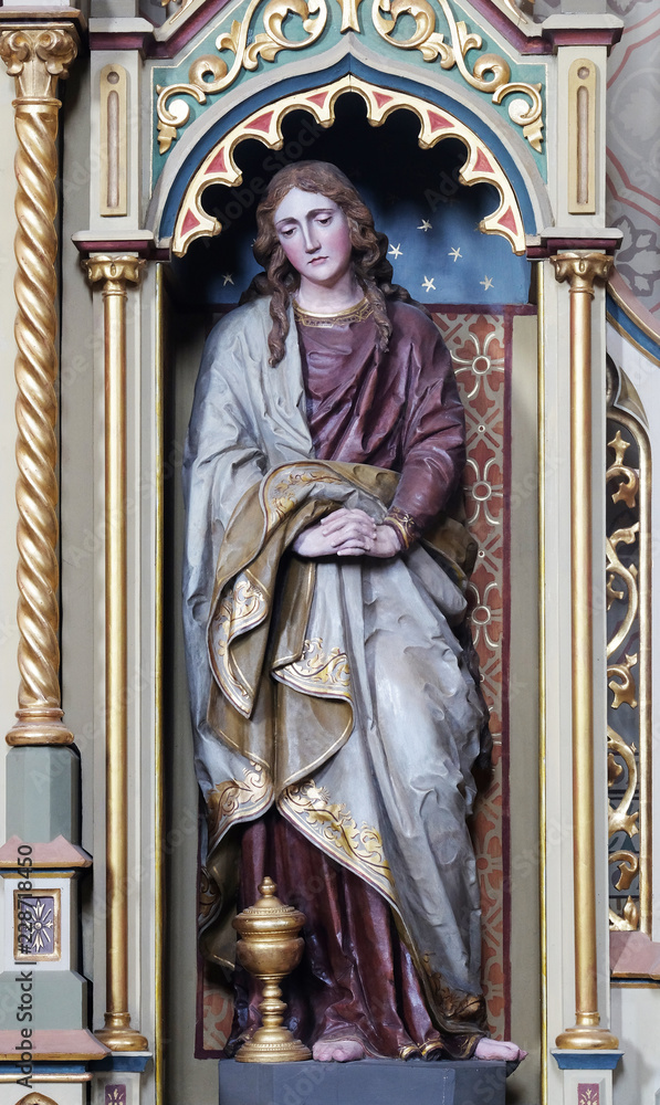 Fototapeta premium Saint Mary Magdalene statue on the Sacred heart of Jesus altar in the church of Saint Matthew in Stitar, Croatia