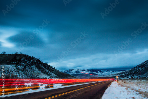 YELLOWSTONE, USA Light trails of a car after last light.