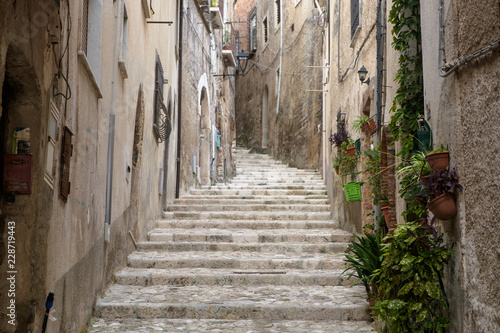 Uphill alley with stairs  to the Medieval center of Caiazzo in the region of Campania, Italy.