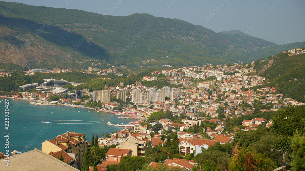 A picturesque view of the historic city of Herceg Novi. The old fortress and part of the historic building are picturesquely stretched over the Adriatic. A visible entrance to Boka Kotorska.