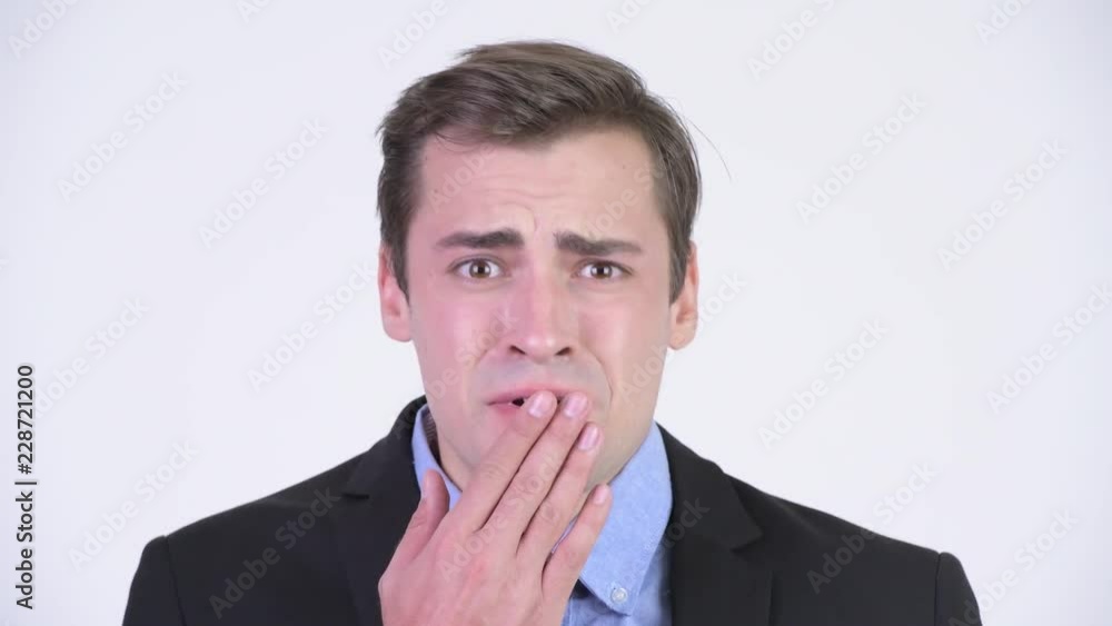 Young stressed businessman looking shocked Young stressed businessman looking shocked