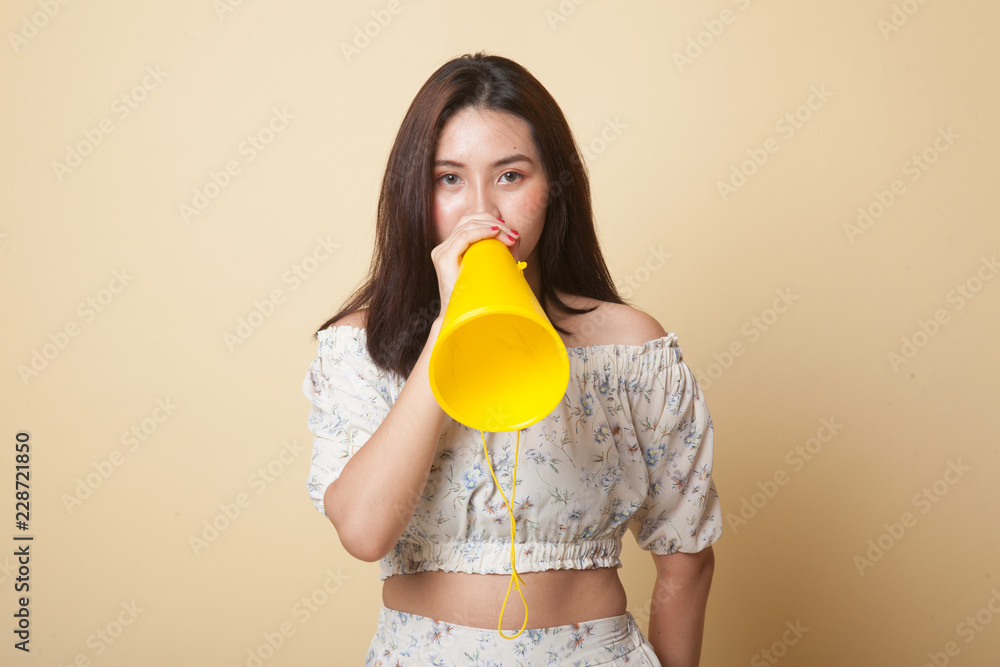 Beautiful young Asian woman announce with megaphone. Beautiful young Asian woman announce with megaphone.