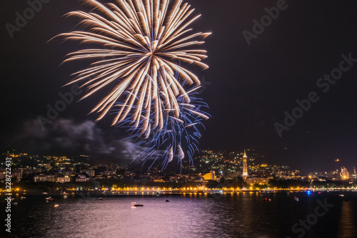 fireworks over the lake of como lecco during a summer night of party