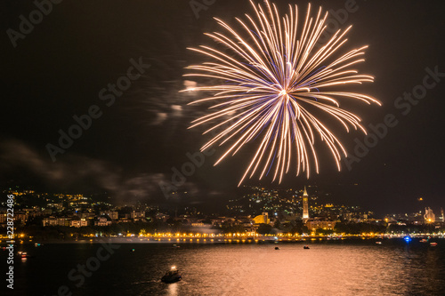 fireworks over the lake of como lecco during a summer night of party