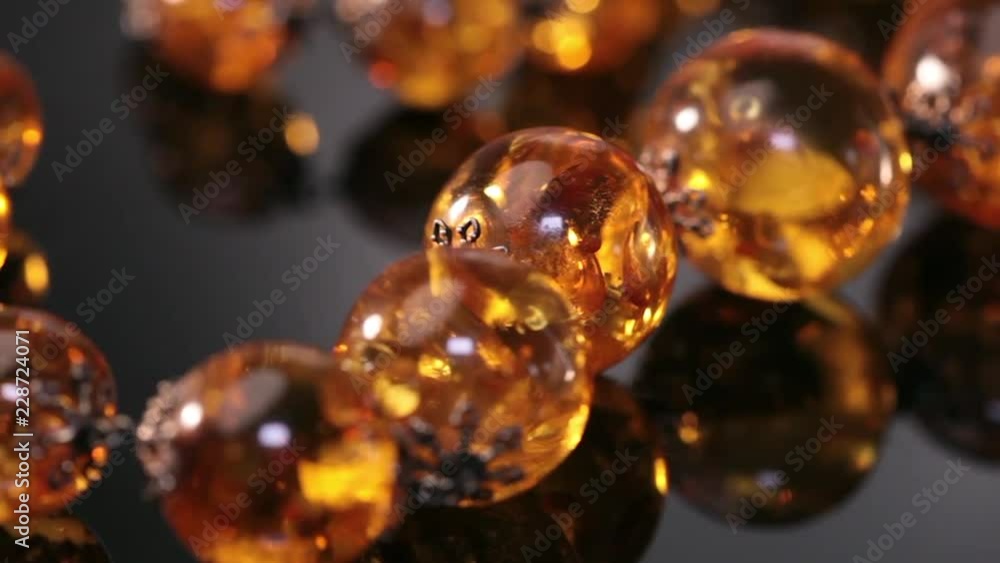 Amber beads on a turn brown background Amber beads on a turn brown background