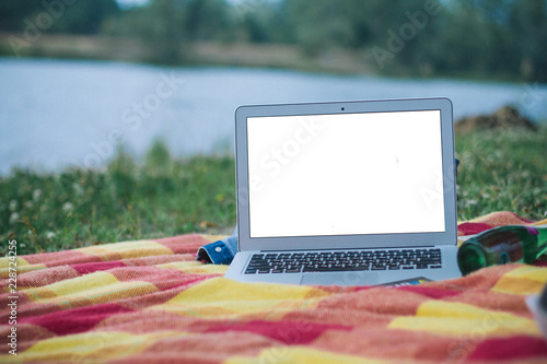 A laptop with white screen outdoor