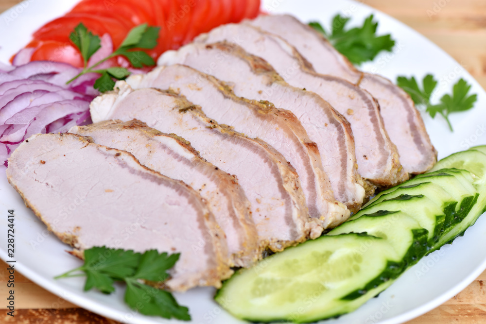 Sliced ham for the holiday. Baked ham with vegetables. Sliced ham for the holiday. Baked ham with vegetables.