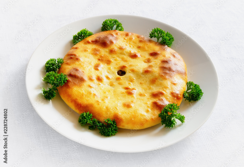 ossetian pie decorated with parsley
