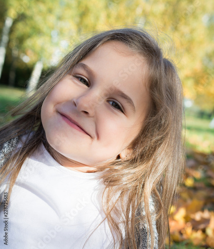 Autumn park  portrait beautiful little girl