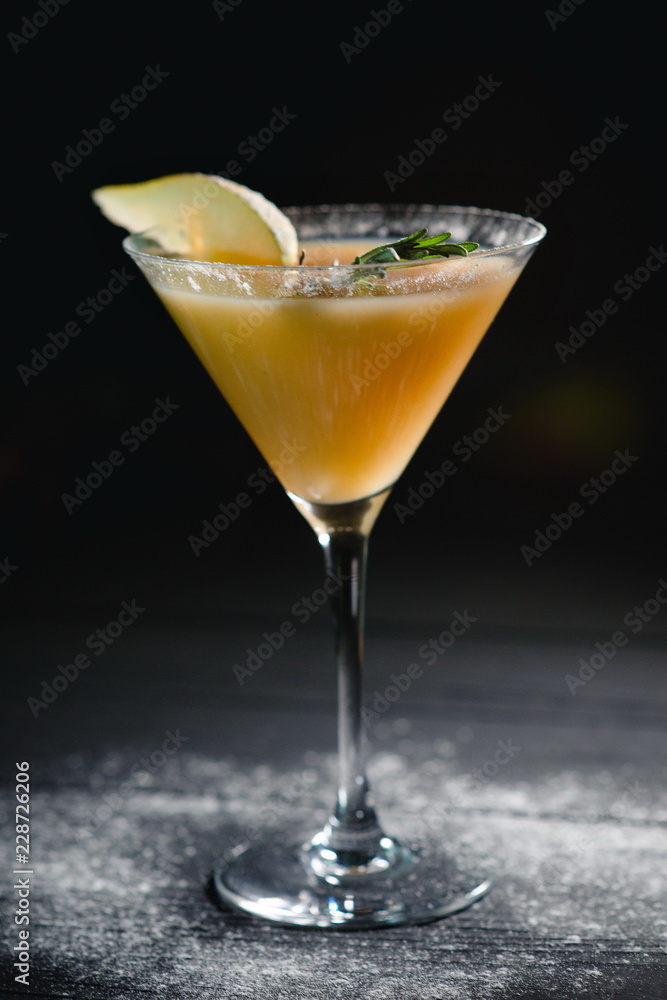 yellow christmas alcohol pear cocktail pear on dark background yellow christmas alcohol pear cocktail pear on dark background