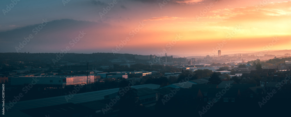 Sheffield City, Yorkshire - Elevated aerial panorama of  the city during a beautiful yellow and orange sunset